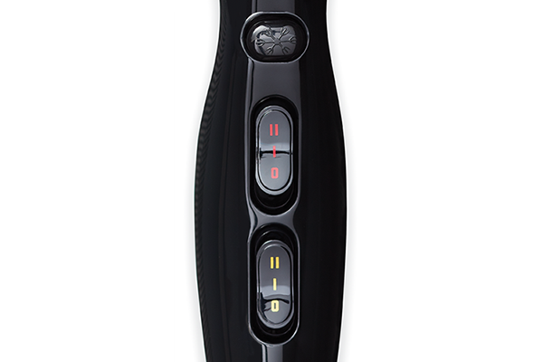 Close-up of black Olivia Garden professional hair dryer control buttons for speed and heat settings