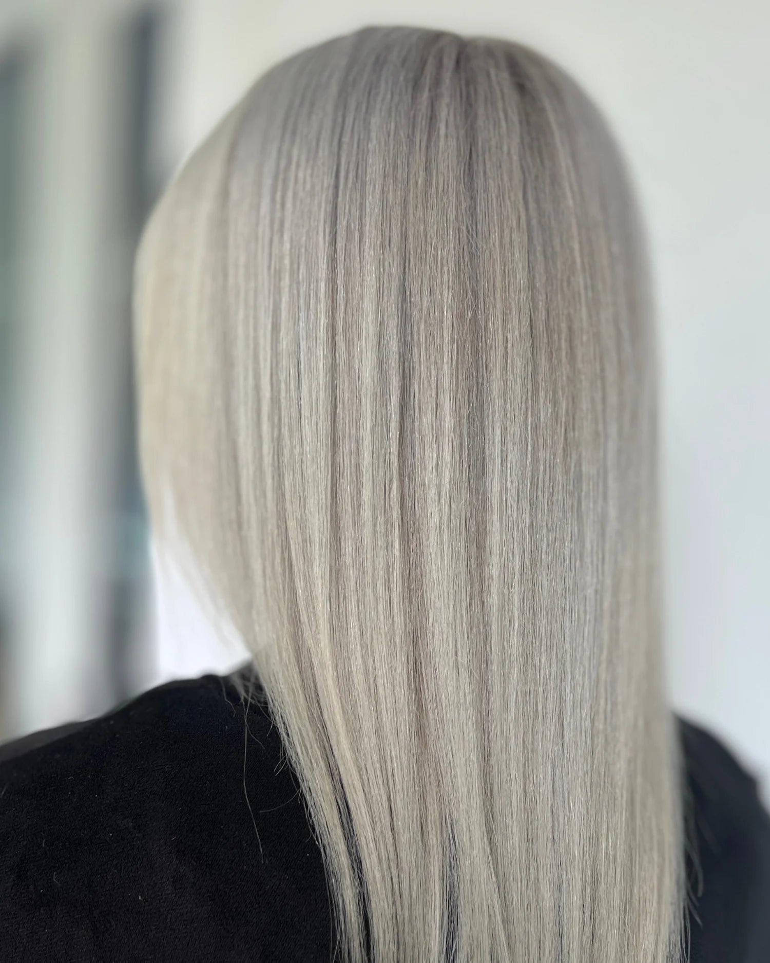 Smooth and shiny silver blonde hair showcasing the effects of One 'N Only silver conditioner 12 oz