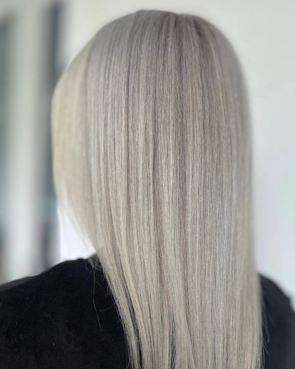 Smooth and shiny silver blonde hair showcasing the effects of One 'N Only silver conditioner 12 oz