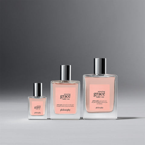Three sizes of Philosophy Amazing Grace Ballet Rose perfume bottles with pink labels and silver caps