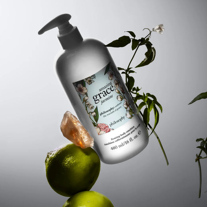 Philosophy Amazing Grace Jasmine body lotion bottle with pump near green limes and floral branch
