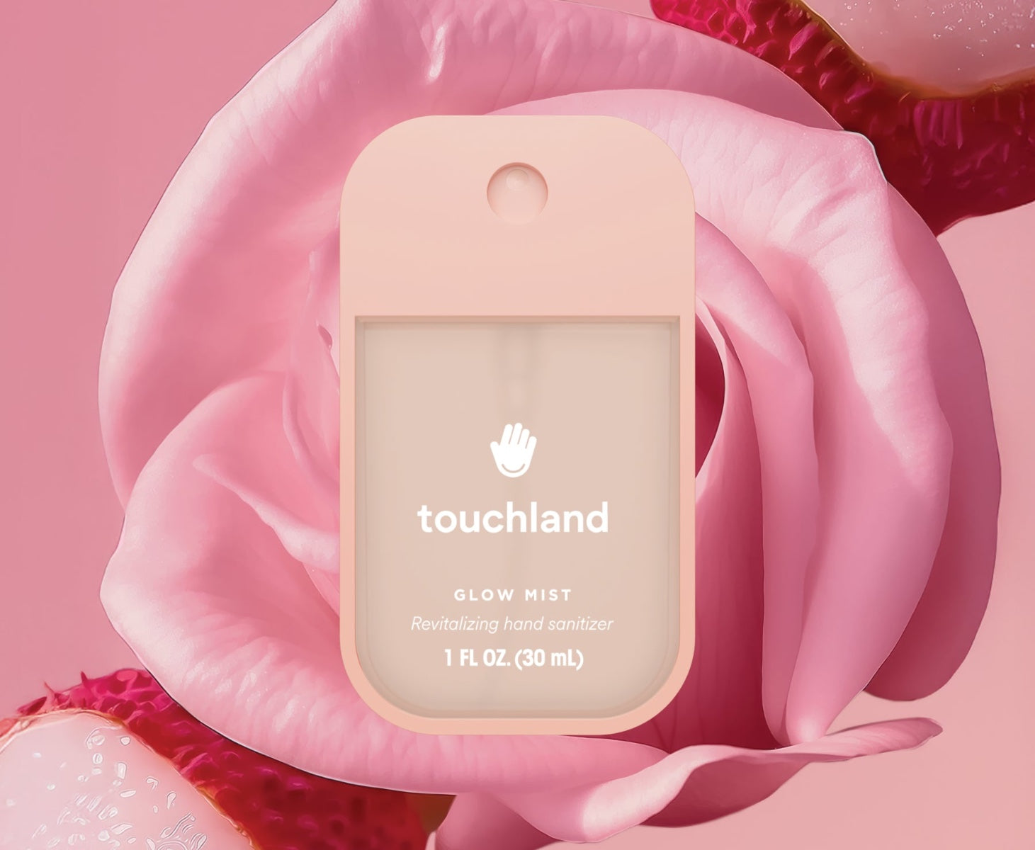 Touchland Glow Mist Rosewater Hand Sanitizer in a 1 fl oz bottle surrounded by pink roses