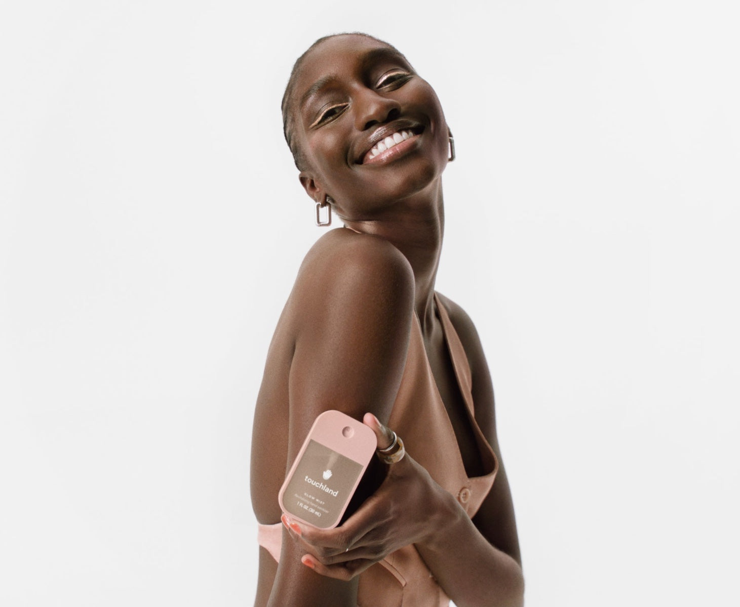 Touchland Rosewater Hand Sanitizer in a pink bottle, perfect for hydration and cleanliness on-the-go