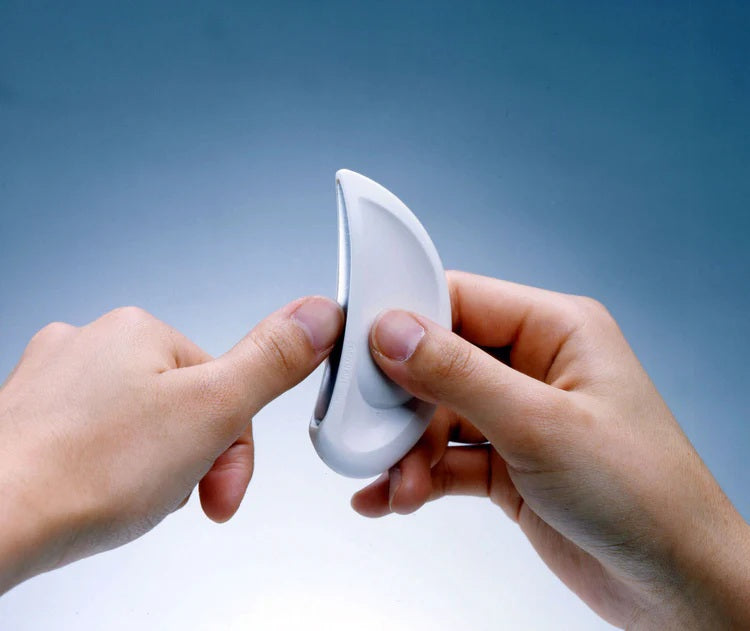 Seki Edge ergonomic file nail tool held between fingers for easy nail care