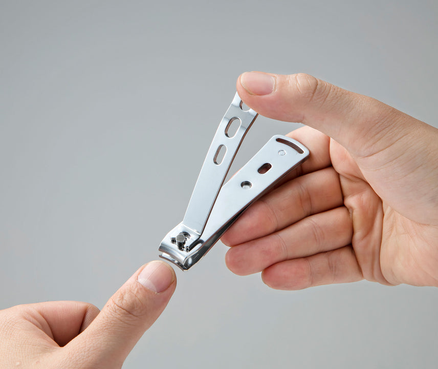 Seki Edge stainless nail clipper, sleek design held in hand for precise nail care