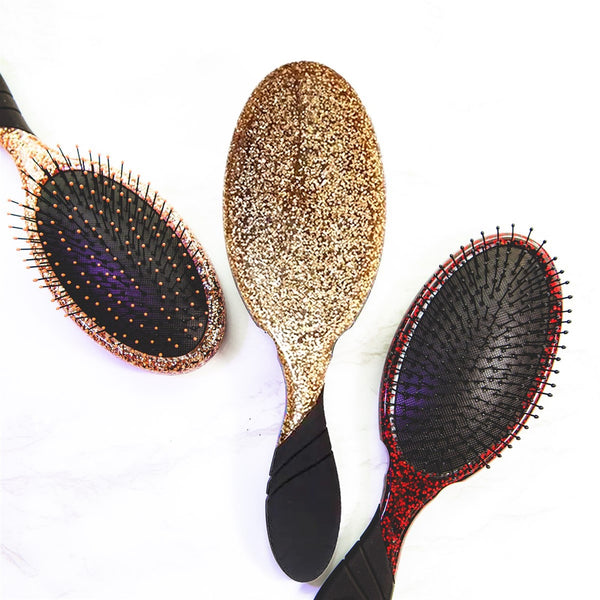 Three Wet Brush Sparkle Hair Detangling Brushes in gold and black designs for effortless styling