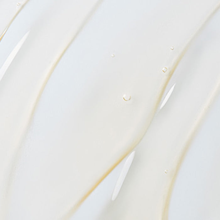Close-up of clear gel texture of St. Tropez body serum with smooth and glossy appearance