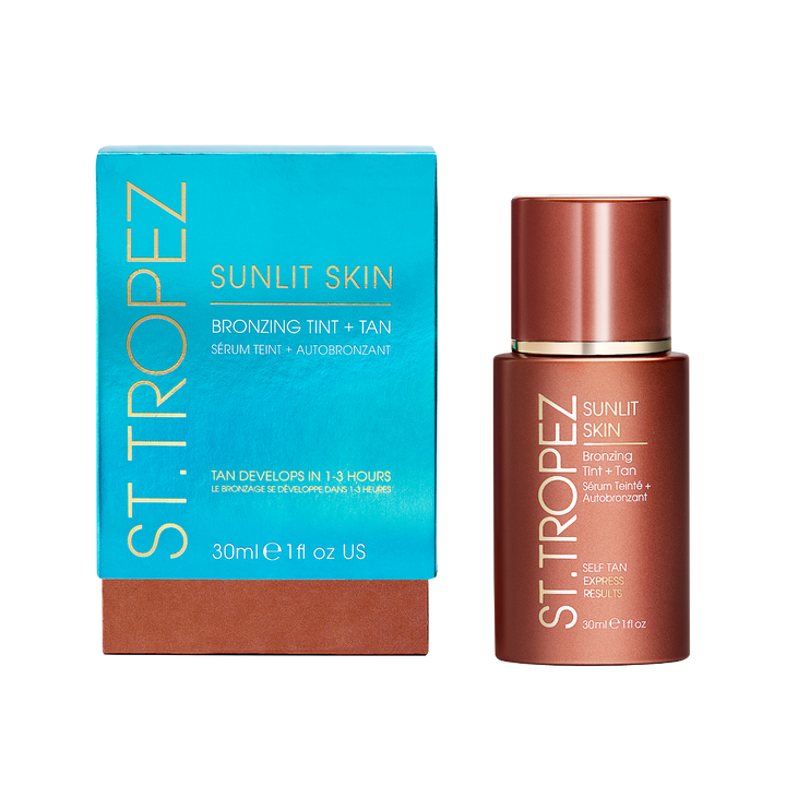 St Tropez bronzing tint Sunlit Skin bottle and blue box with self tan serum for glowing skin