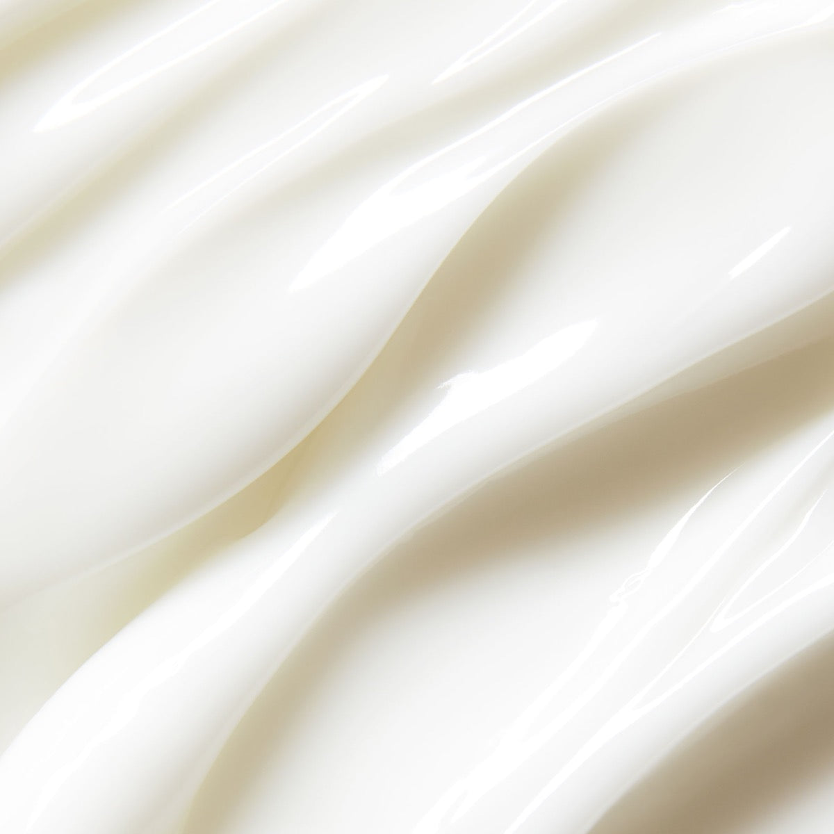 Close-up of smooth creamy texture of St. Tropez gradual tan lotion medium dark