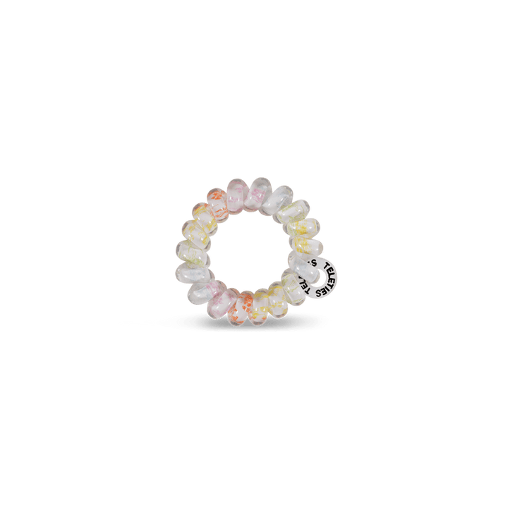 Teleties tiny hair ties in pastel colors, perfect for holding hair without damage