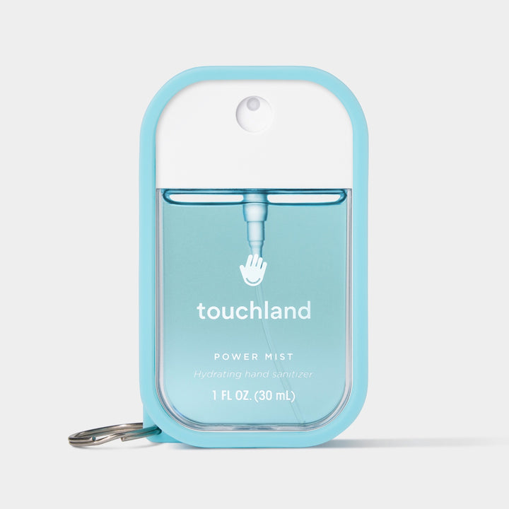 Touchland hand sanitizer mist in blue bottle, 1 FL OZ, convenient spray for hydration and cleanliness