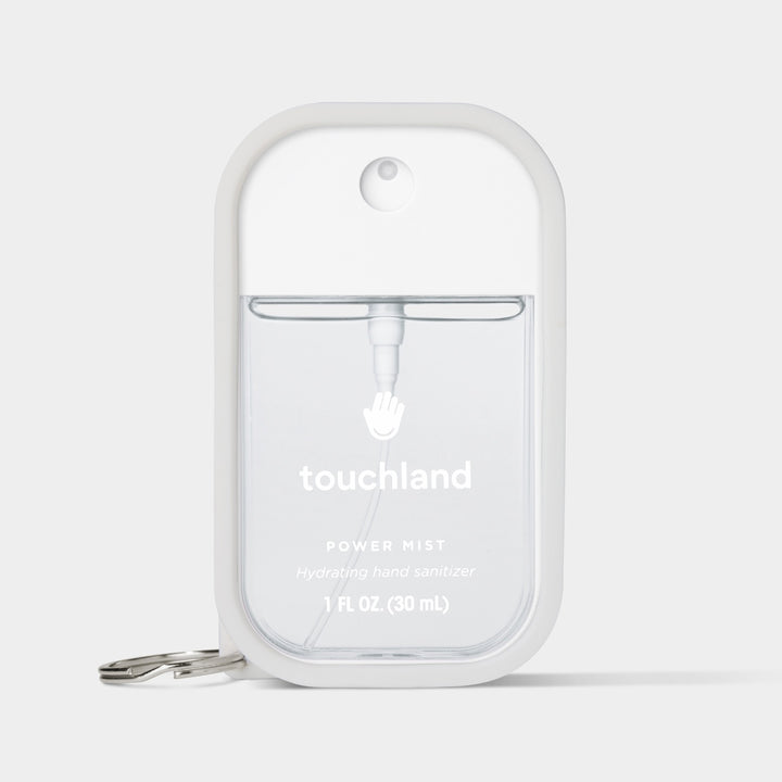 Touchland hand sanitizer mist in a sleek dispenser with a keychain for easy portability
