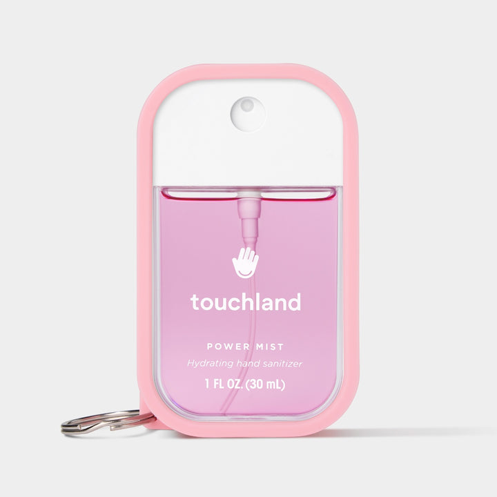 Touchland hand sanitizer mist in a pink container, 1 FL OZ, with hydrating formula for on-the-go use
