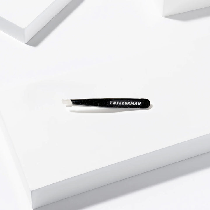 Tweezerman Slant Tip Tweezers in sleek black for precise grooming and brow shaping