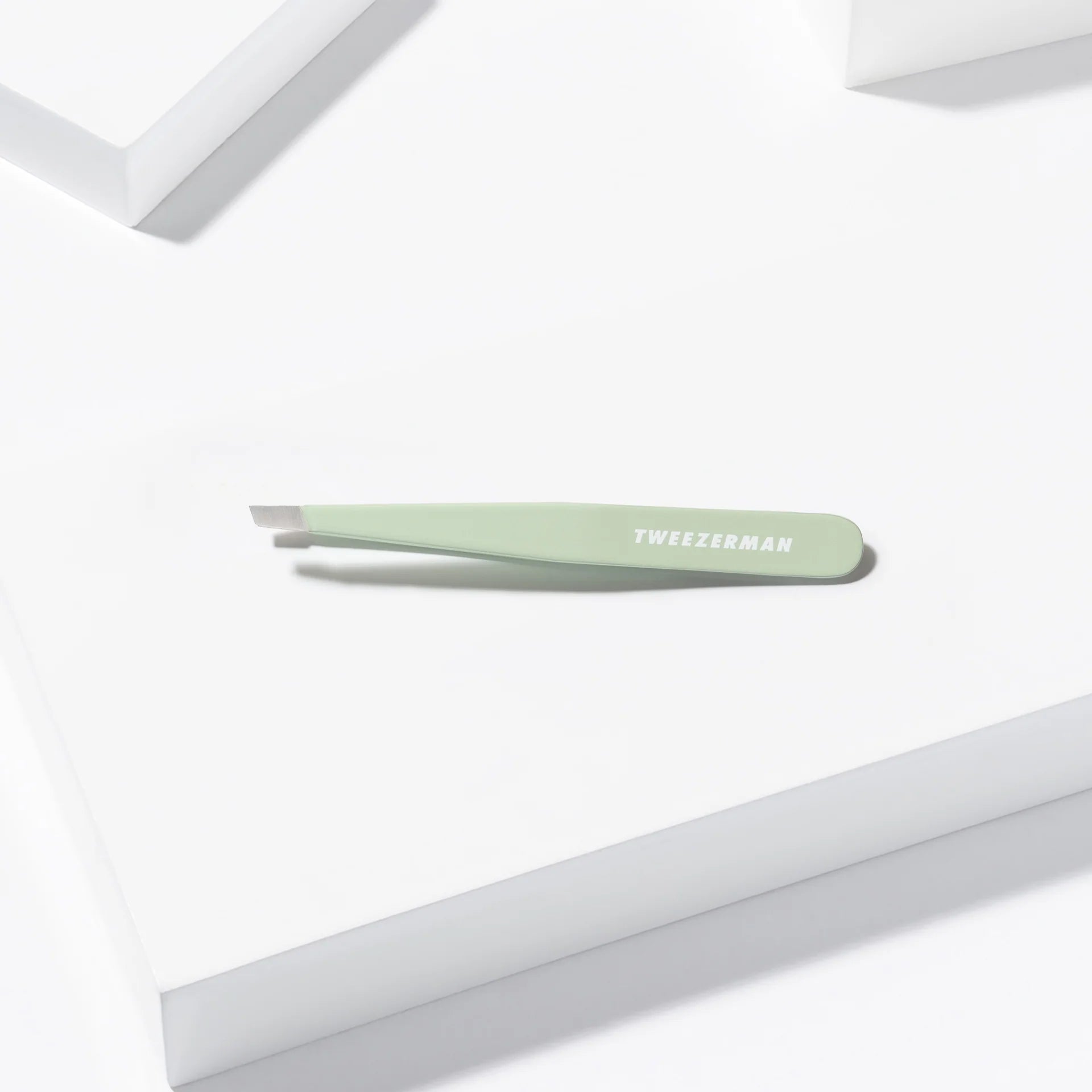 Tweezerman tweezers in mint green color with precision tip for flawless hair removal