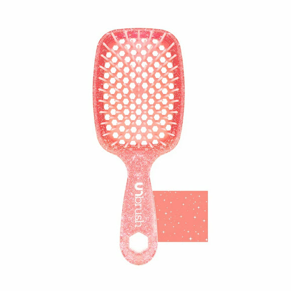 Unbrush original full sized hair brush in coral with flexible bristles and ventilated design