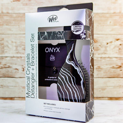 Wet Brush Mystical Crystal Detangler in black and white marble pattern with Onyx crystal bracelet set in limited edition packaging