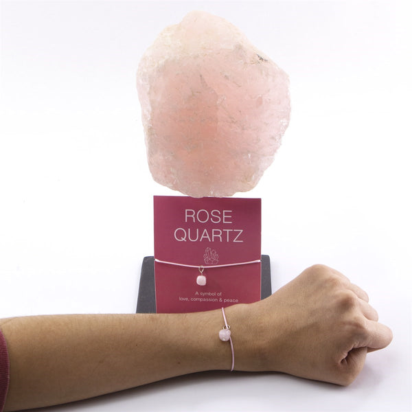 Wet Brush Mystical Crystal Detangler rose quartz stone displayed with matching bracelet on wrist