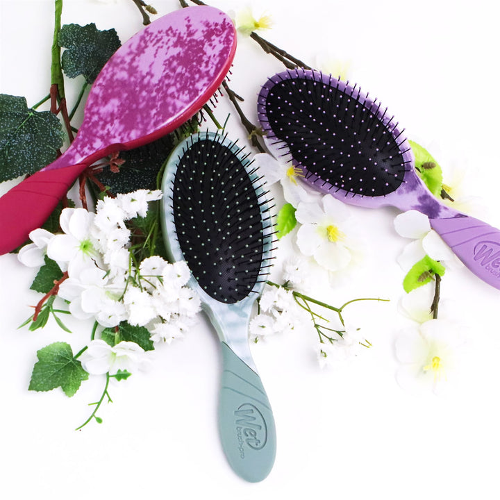 Wet Brush Pro Detangler Brush Floral Shadows in pink, purple, and blue surrounded by white flowers
