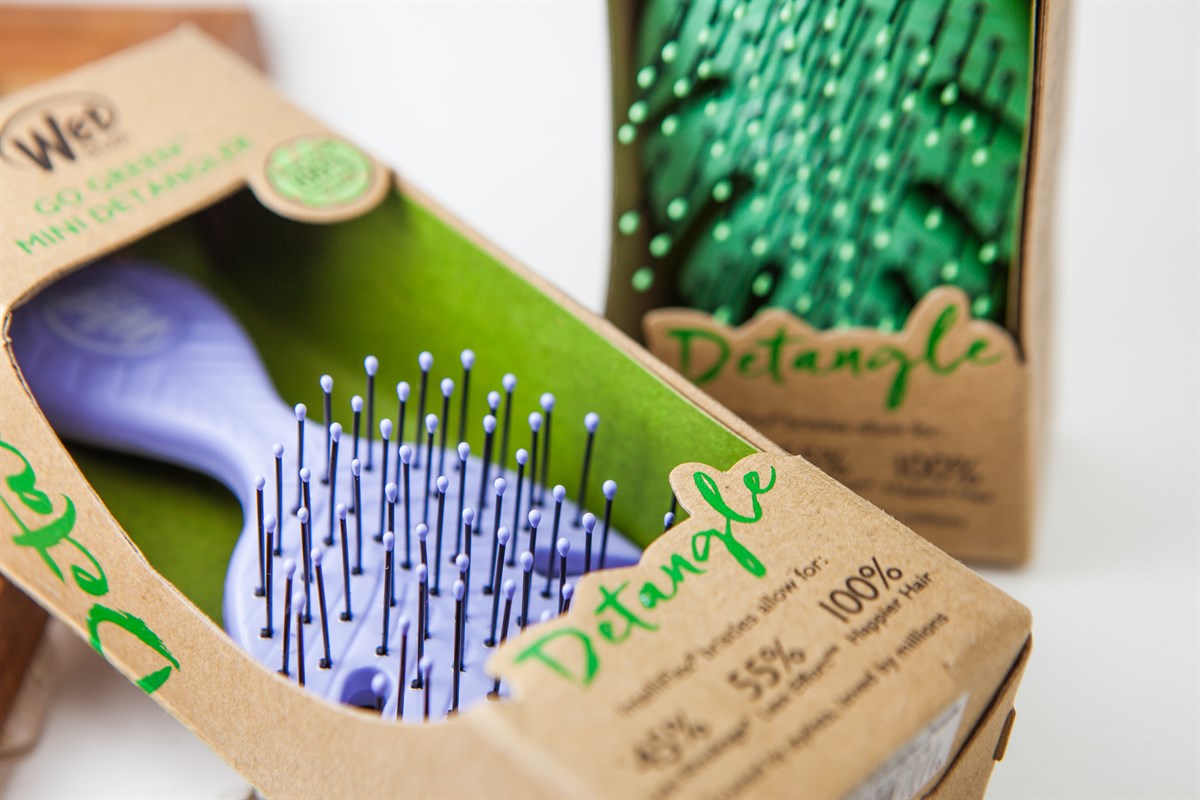 Wet Brush eco-friendly mini hairbrush in purple with soft bristles in recyclable packaging