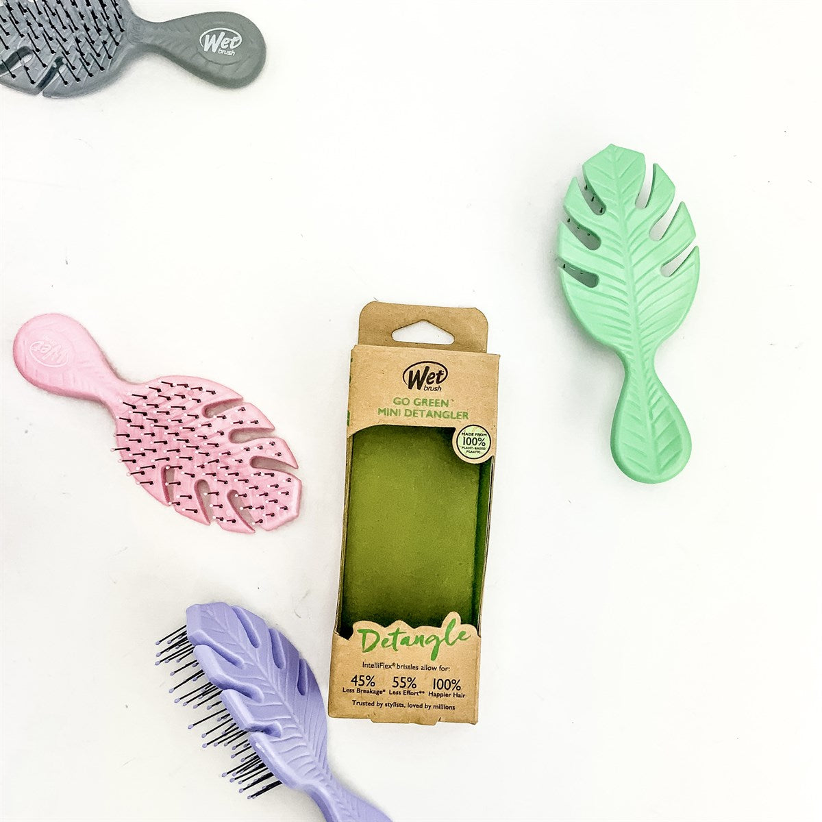 Wet Brush eco-friendly mini hairbrushes in pastel colors with leaf design and packaging