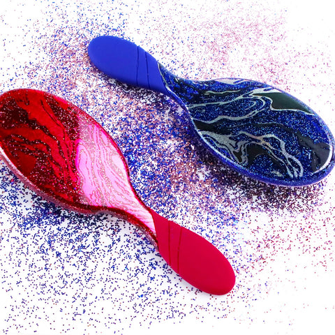 Wet Brush sparkle finish detangling brush in red and blue with glittery swirls and comfortable handles