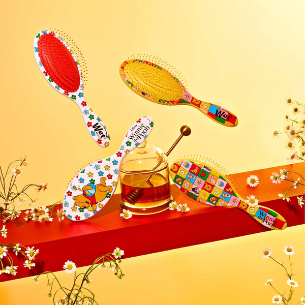 Winnie the Pooh hair detangler brush set with colorful designs for easy and gentle styling