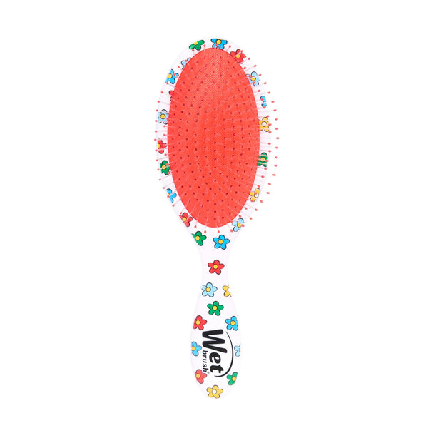 Winnie the Pooh hair detangler brush with colorful floral design for gentle styling
