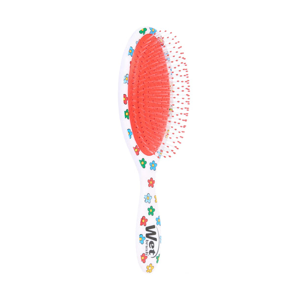 Winnie the Pooh hair detangler brush with colorful flower designs and flexible bristles for gentle hair care