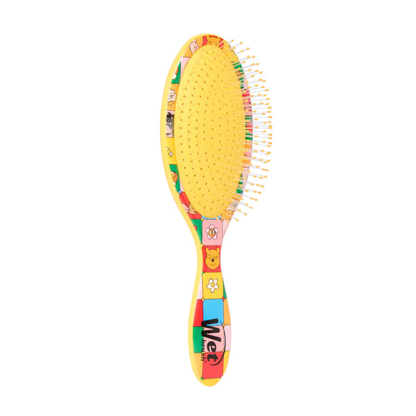Winnie the Pooh hair detangler brush with colorful character design for gentle and easy hair styling