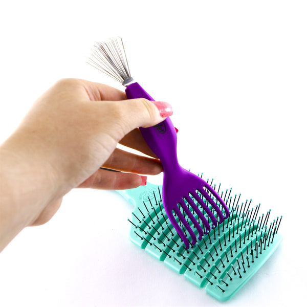 Wet Brush professional hair brush cleaner tool with purple handle cleaning a teal hairbrush