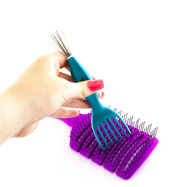 Wet Brush professional hair brush cleaner tool with blue handle cleaning a purple hairbrush