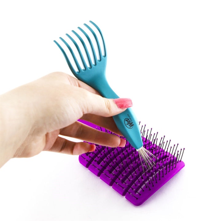 Wet Brush professional hair brush cleaner tool with blue ergonomic handle used on a purple hairbrush