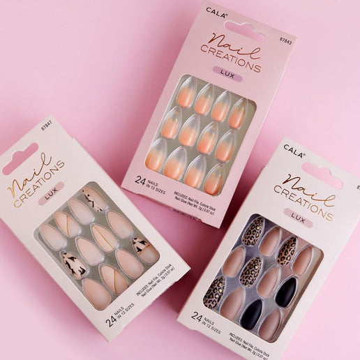 Three packs of Cala press on nails featuring various nail designs in pink and neutral tones