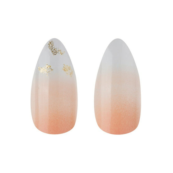 Cala press on nails with peach to white gradient and gold foil accents for elegant nail art