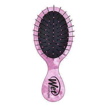 Wet Brush Mini Detangler in pink with flexible bristles designed for gentle hair detangling