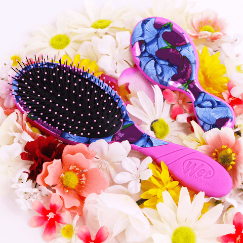 Wet Brush with butterfly design hairbrush featuring vibrant blue and purple butterflies on handle surrounded by colorful flowers