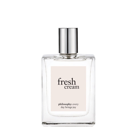 Philosophy Fresh Cream perfume with clear glass bottle and silver cap on white background