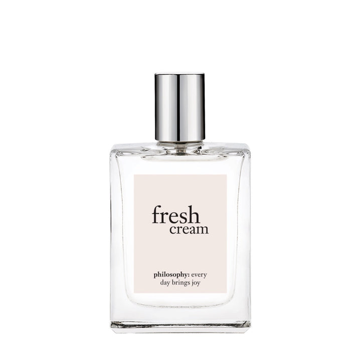 Philosophy Fresh Cream perfume with clear glass bottle and silver cap on white background