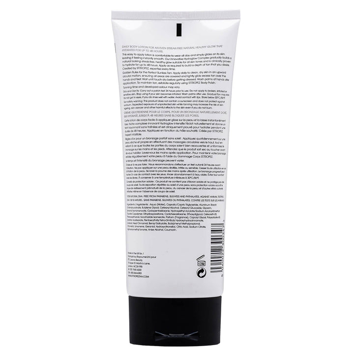 Back view of St Tropez light medium gradual tan self-tanning body cream tube with detailed usage instructions