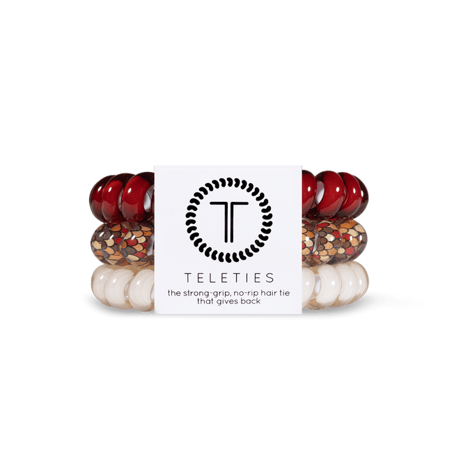 Teleties strong grip hair ties in red, white, and gold with no-rip design for reliable hold