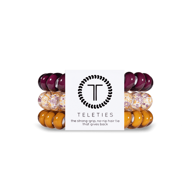 Teleties strong grip hair ties in purple and yellow hues for a secure and stylish hold