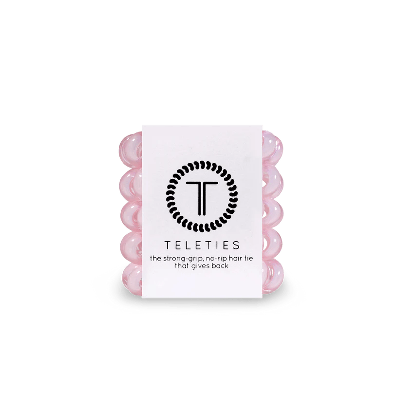 Pack of Teleties tiny hair ties in pink, designed for a strong grip and no rip quality