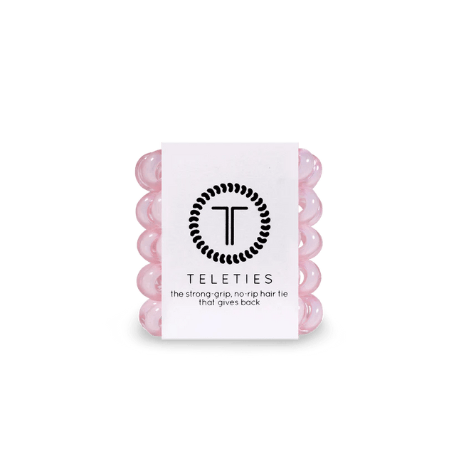 Pack of Teleties tiny hair ties in pink, designed for a strong grip and no rip quality