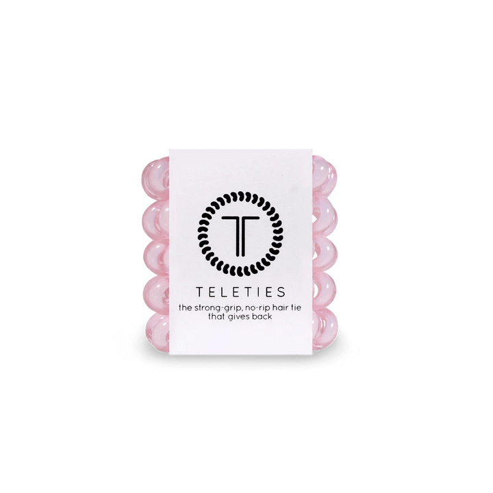 Pack of Teleties tiny hair ties in pink, designed for a strong grip and no rip quality