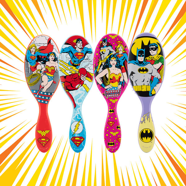Justice League detangler brush set featuring superhero designs from Wonder Woman, Superman, and Batman