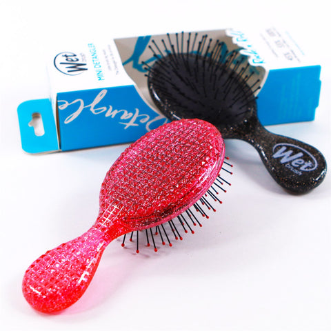 Wet Brush Travel Size Detangler Brush set in pink and black for quick and easy detangling on the go