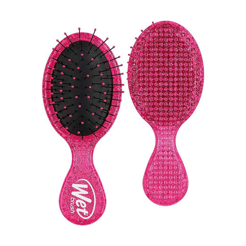 Wet Brush travel size detangler brush in pink with flexible bristles for easy hair detangling